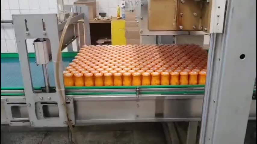 Filled fruit jars on a packing line